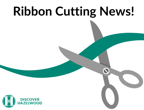 Scissors cutting a ribbon